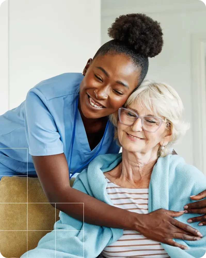 A staff member with a member at South Richmond Adult Day Center