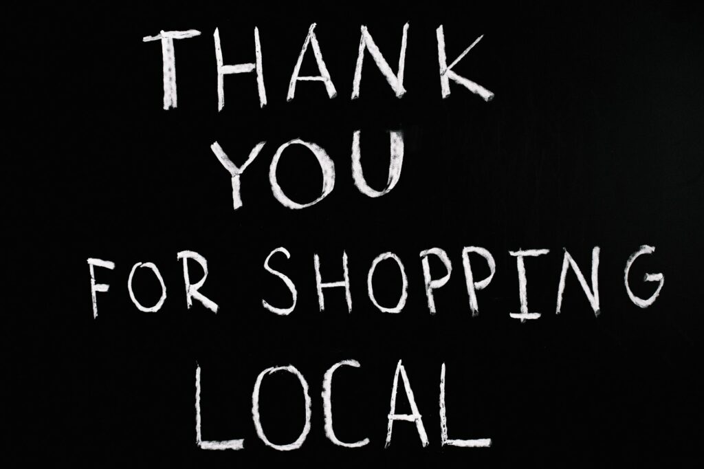 A chalkboard sign saying Thank You For Shopping Local